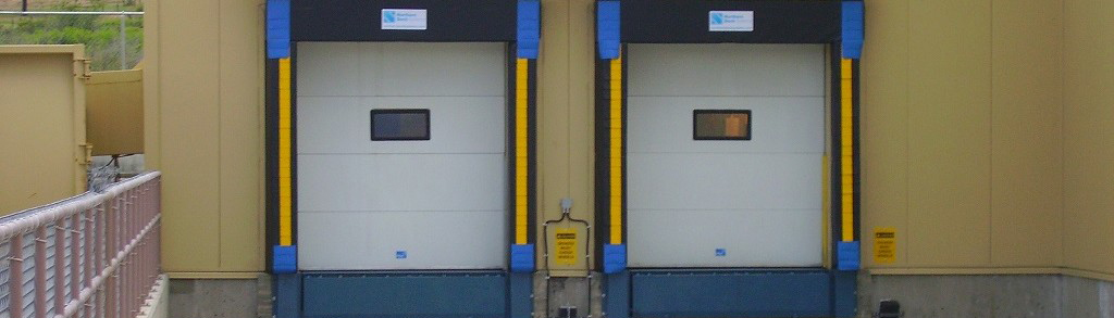 Dock seals overhead sectional door with window dock leveler steel faced bumpers in Vancouver Langley BC